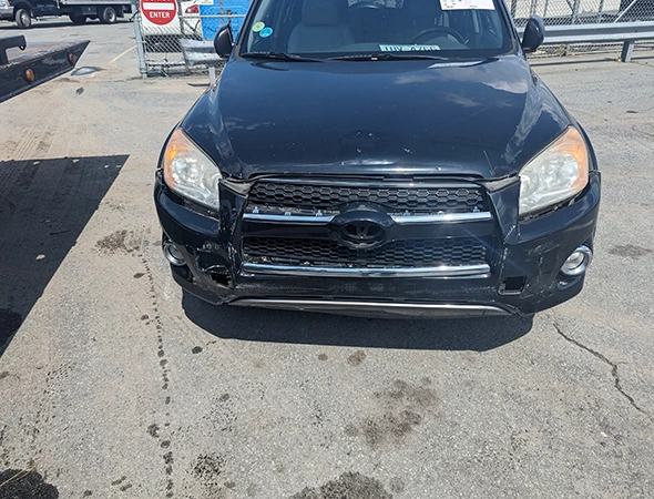 Front view of a black Toyota SUV parked on pavement, illustrating emergency mobile water pump repair services in Concord, NC.